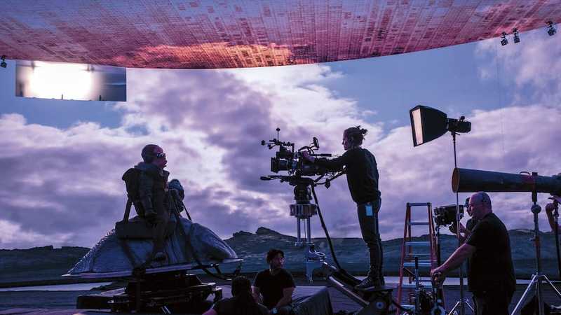 TV recording studio with control room and a green screen